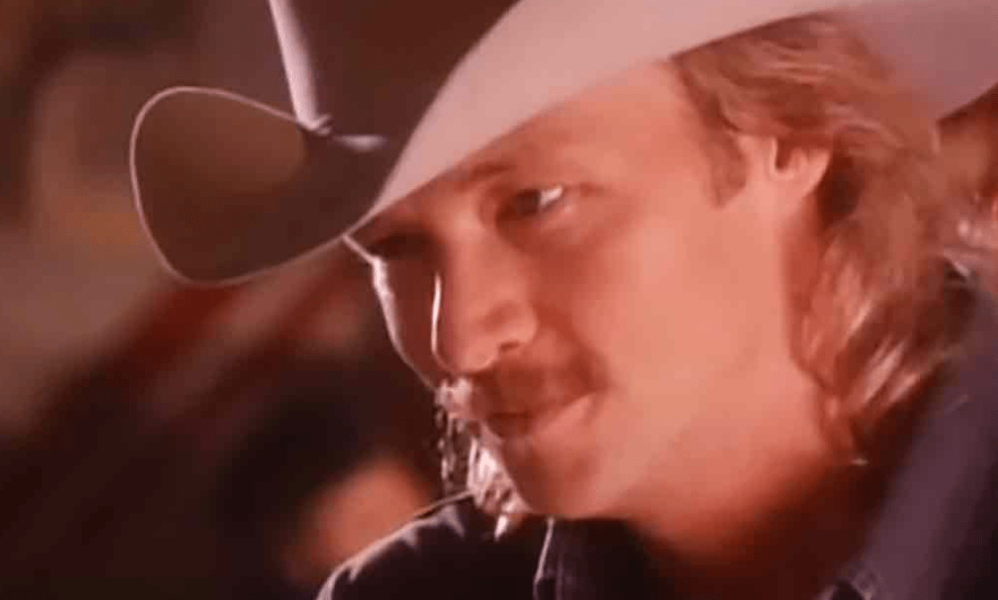 Alan Jackson’s “Chasin’ That Neon Rainbow” will sweep you away.