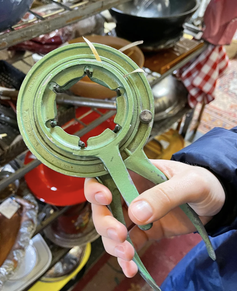 Strange Green circular tool with spikes