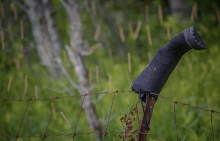 The Meaning Behind a Boot on a Fence Post