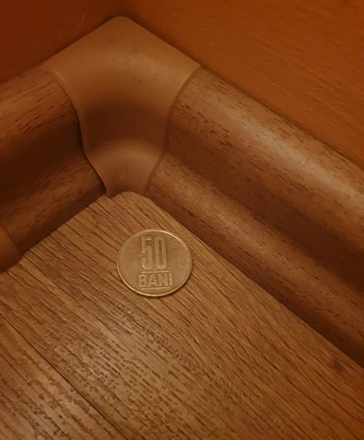 What happens if you put a 50 cent coin in the corner of the room?